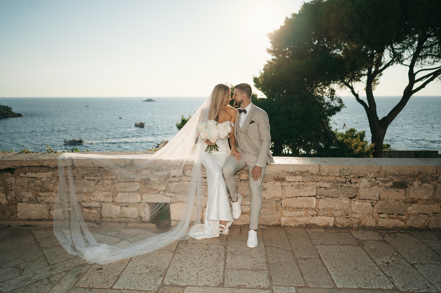 A wedding in the historic town of Rovinj, with a ceremony held between the pine trees and a stunning view of the sea.