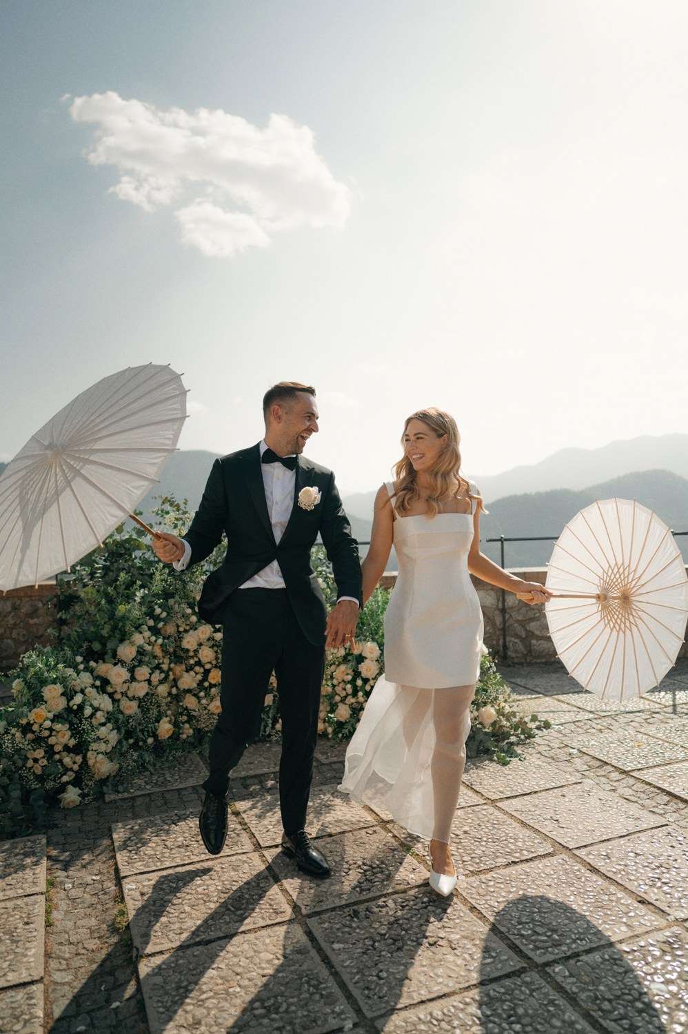 bride and groom married at castle bled with sun umbrellas